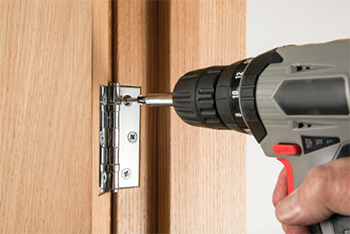 Screw hinge into the wall